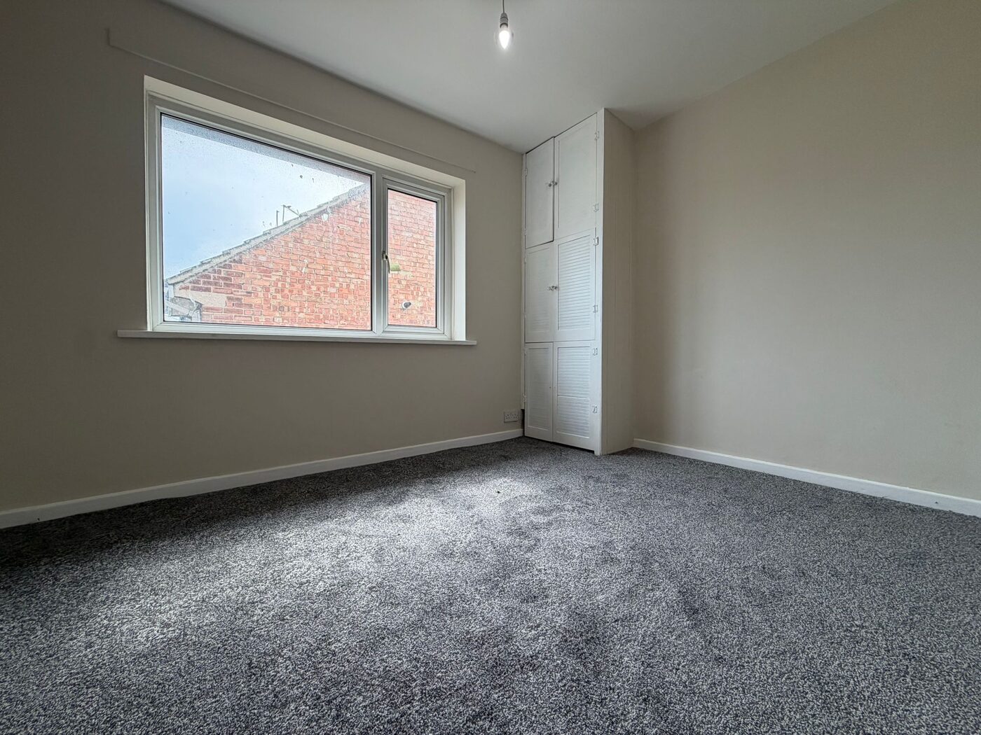 Refurbished bedroom with built-in storage