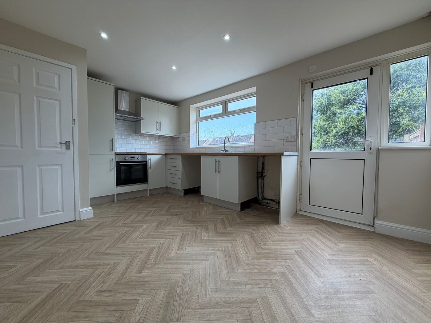 Refurbished kitchen with new units and back door